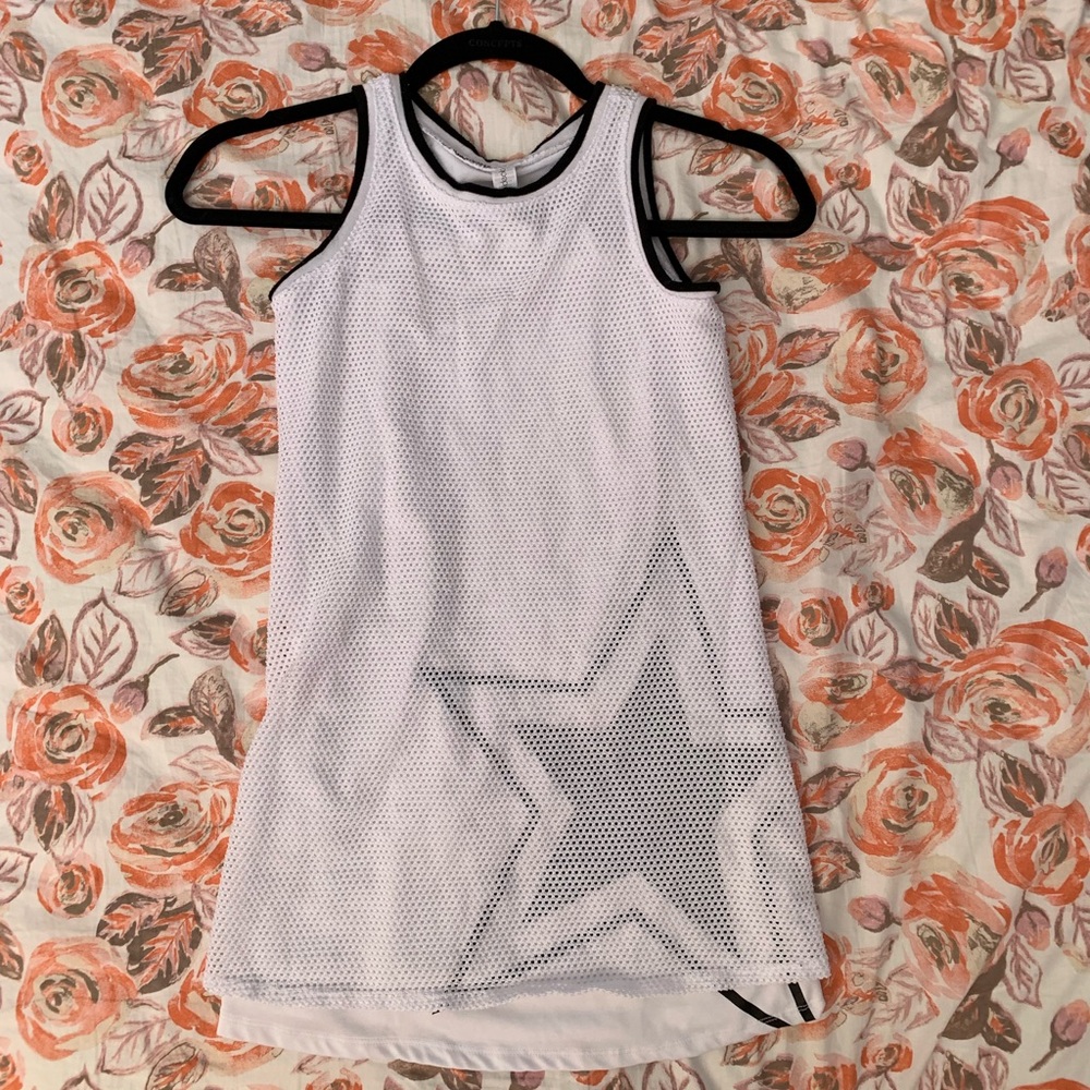 White dress with a star and net on top